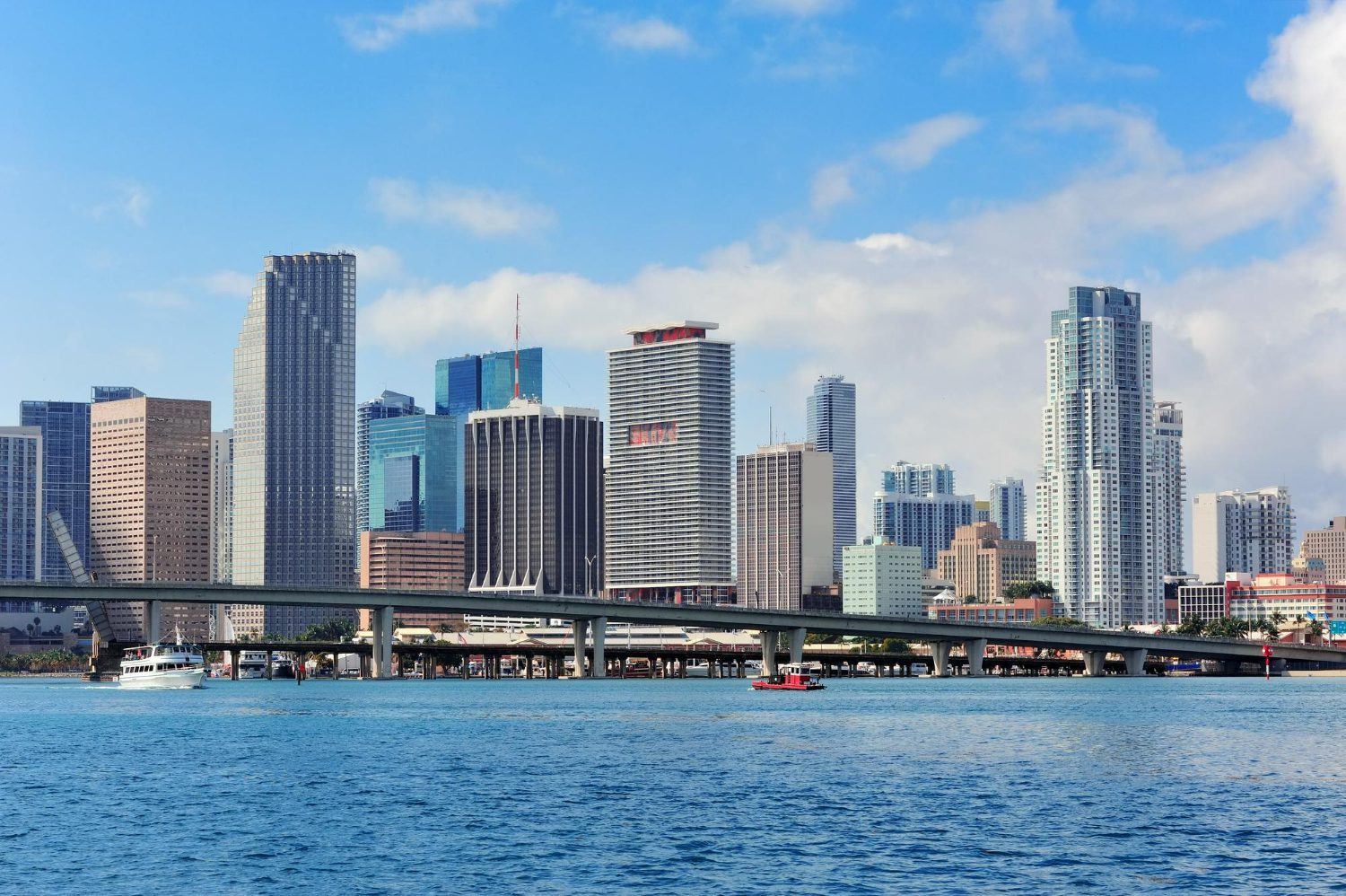 miami-skyscrapers-with-bridge-sea-day miami-skyscrapers-with-bridge-sea-day